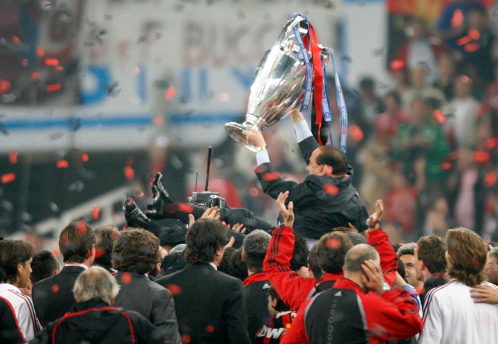 AC Milan’s president Silvio Berlusconi celebrates with the trophy after winning the Champions League football match against Liverpool at the Olympic Stadium, in Athens, 23 May 2007. AFPPIX