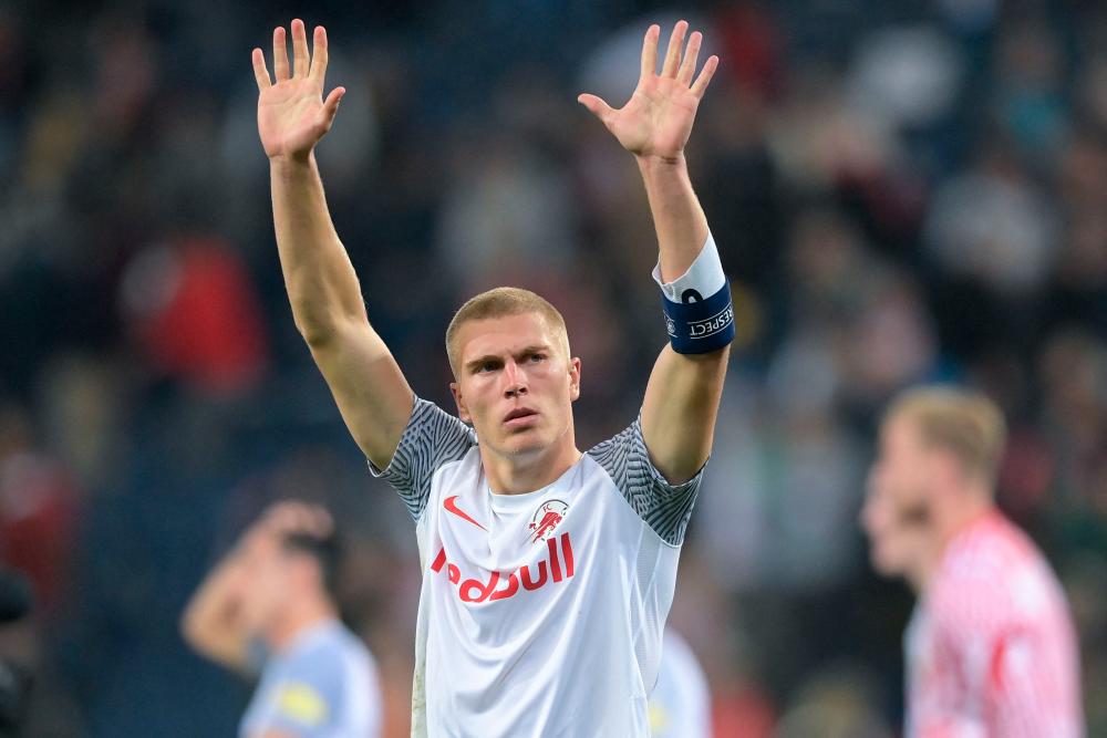 (FILES) In this file photo taken on October 20, 2021 Salzburg’s Danish defender Rasmus Kristensen celebrates with their fans after the UEFA Champions League Group G football match between RB Salzburg and VfL Wolfsburg in Salzburg, Austria. Leeds signed Denmark defender Rasmus Kristensen from RB Salzburg for a reported £8.5 million ($10.6 million) on Wednesday, June 8. AFPPIX