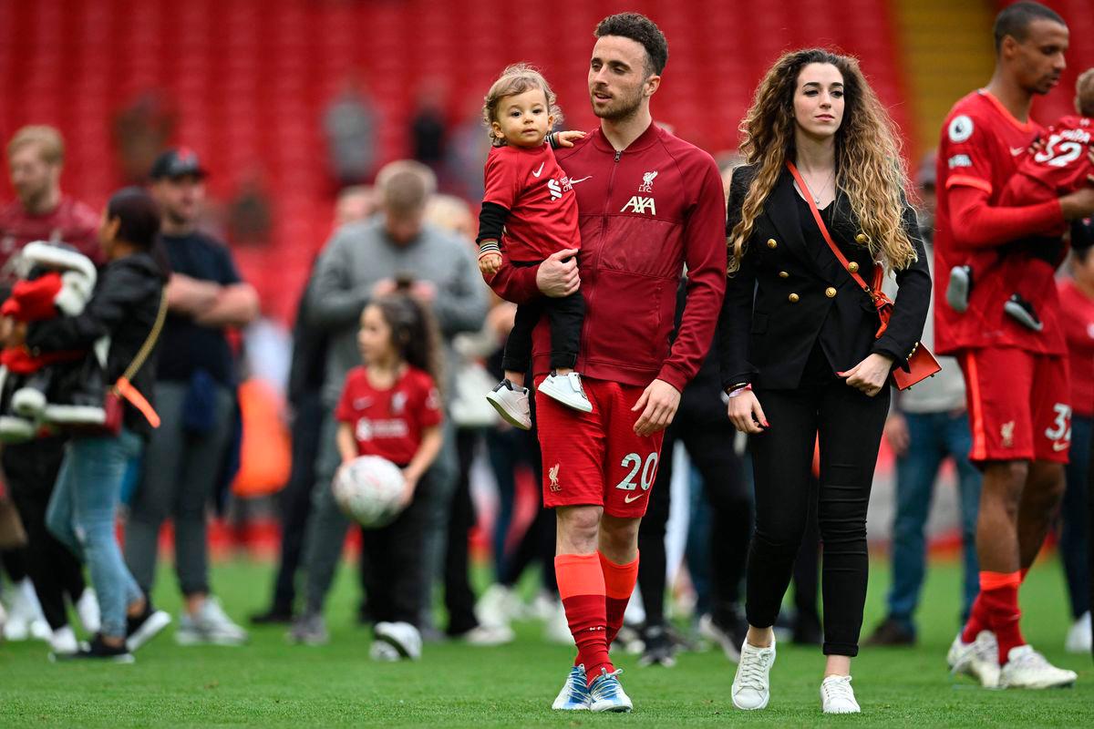 (FILES) Liverpool’s Portuguese striker Diogo Jota celebrates his family during a lap of honour at the end of the English Premier League football match between Liverpool and Wolverhampton Wanderers at Anfield in Liverpool, north west England on May 22, 2022-AFP
