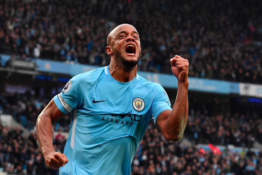 In this file photo taken on April 7, 2018 Manchester City's Belgian defender Vincent Kompany celebrates scoring the opening goal during the English Premier League football match between Manchester City and Manchester United at the Etihad Stadium in Manchester, north west England. — AFP