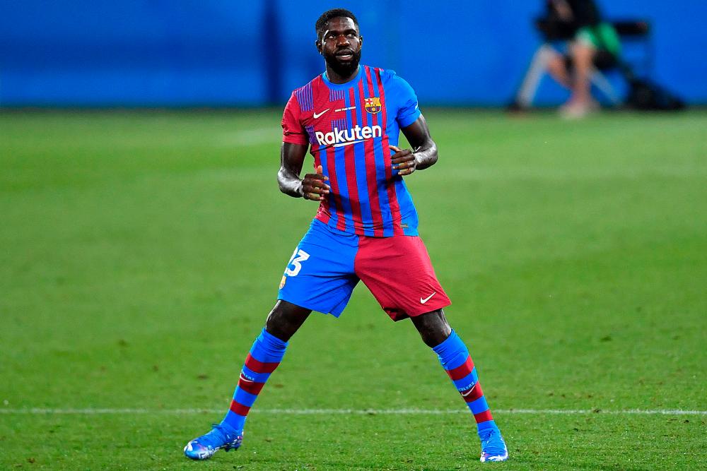 (FILES) In this file photo taken on August 8, 2021 Barcelona’s French defender Samuel Umtiti enters the pitch during the 56th Joan Gamper Trophy friendly football match between Barcelona and Juventus at the Johan Cruyff Stadium in Sant Joan Despi near Barcelona. AFPPIX