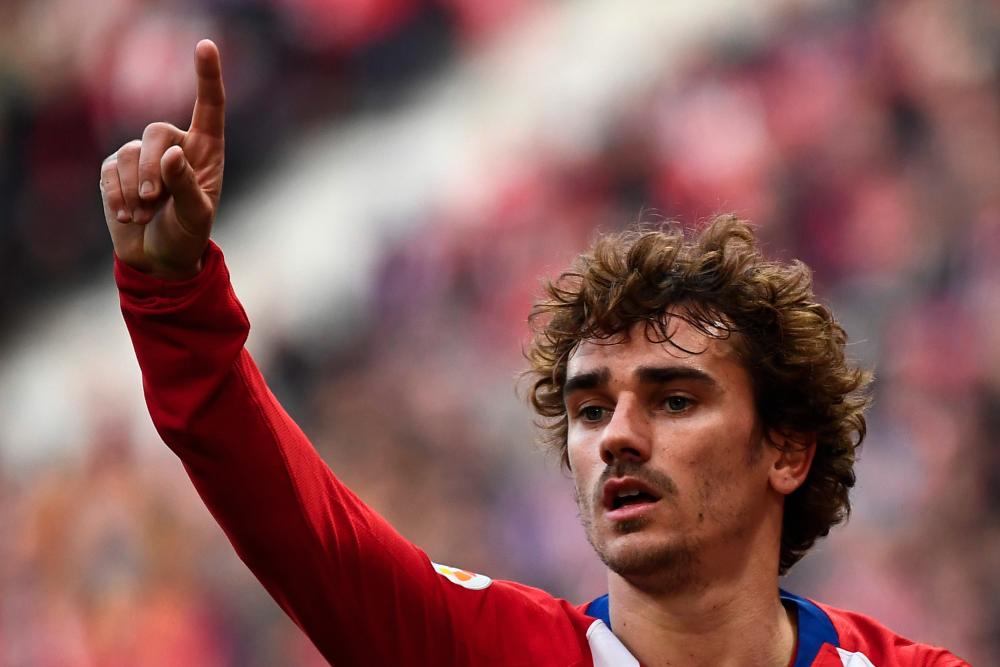 In this file photo taken on Feb 9, 2019 Atletico Madrid's French forward Antoine Griezmann celebrates after scoring during the Spanish league football match Club Atletico de Madrid against Real Madrid CF at the Wanda Metropolitano stadium in Madrid. - AFP