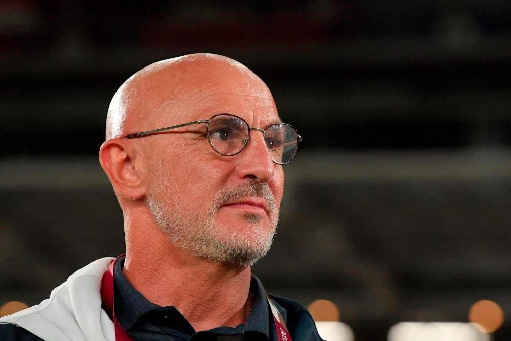 (FILES) In this file photo taken on August 7, 2021 Spain’s coach Luis de la Fuente Castillo is pictured before the Tokyo 2020 Olympic Games football competition men’s gold medal match against Brazil at Yokohama International Stadium in Yokohama, Japan/AFPPIX