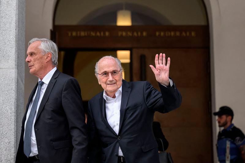 Former FIFA president Sepp Blatter (right) waves to journalists next to his lawyer Lorenz Erni (left). PIX AFP.