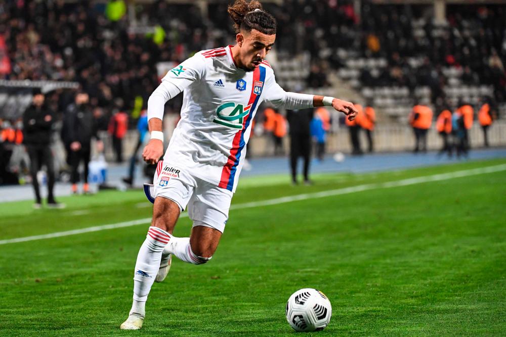 In this file photo taken on December 17, 2021 Lyon’s French defender Malo Gusto plays the ball during the French Cup round of 64 football match between Paris FC and Olympique Lyonnais (OL) at the Charlety stadium in Paris. AFPPIX