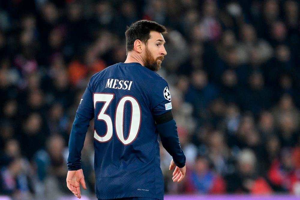 (FILES) In this file photo taken on February 14, 2023 Paris Saint-Germain's Argentinian forward Lionel Messi walks in the pitch during first leg of the UEFA Champions League round of 16 football match between Paris Saint-Germain (PSG) and FC Bayern Munich at the Parc des Princes stadium in Paris. AFPPIX