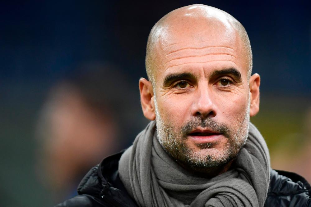In this file photo taken on November 06, 2019 Manchester City's Spanish manager Pep Guardiola attends the UEFA Champions League Group C football match Atalanta Bergamo vs Manchester City at the San Siro stadium in Milan. - AFP