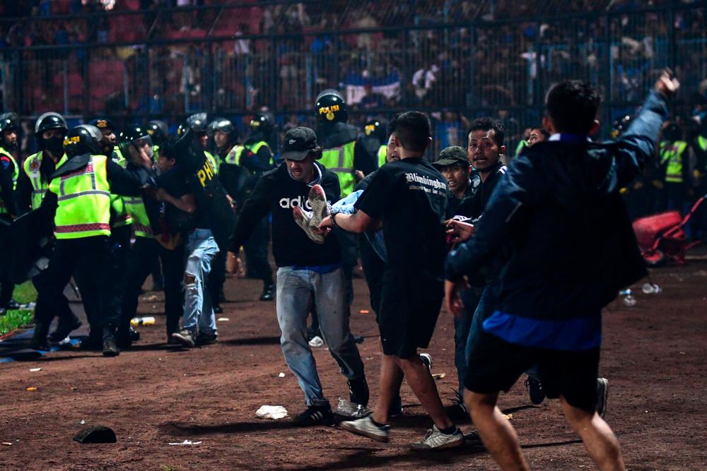 The Indonesian stadium where 135 people died in October 2022 in one of football's worst tragedies lies empty but intact, despite government pledges to demolish it and rebuild a safer site. AFPPIX