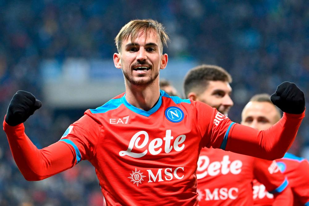 (FILES) In this file photo taken on December 1, 2021 Napoli’s Spanish midfielder Fabian Ruiz celebrates after opening the scoring during the Italian Serie A football match between Sassuolo and Napoli at the Citta del Tricolore stadium in Reggio Emilia. AFPPIX