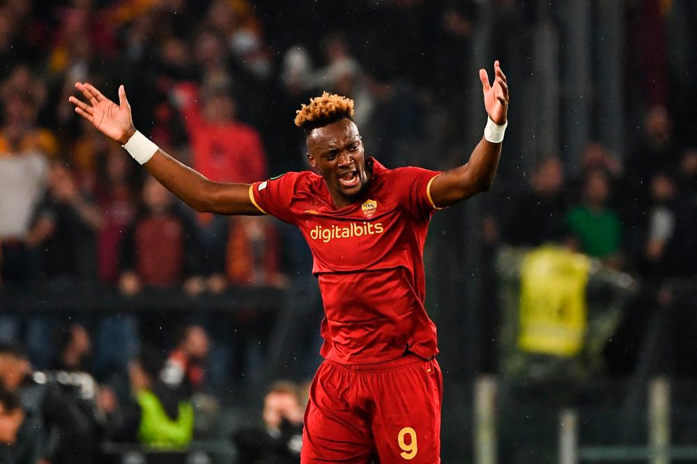 (FILES) In this file photo taken on May 05, 2022 Roma’s British forward Tammy Abraham celebrates after opening the scoring during the UEFA Conference League semi-final second leg football match between AS Roma and Leicester City at The Olympic Stadium in Rome, on May 5, 2022. AFPPIX