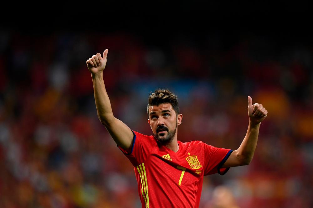 In this file photo taken on September 2, 2017 Spain's forward David Villa waves as he celebrates their victory at the end of the World Cup 2018 qualifier football match Spain vs Italy at the Santiago Bernabeu stadium in Madrid. - AFP