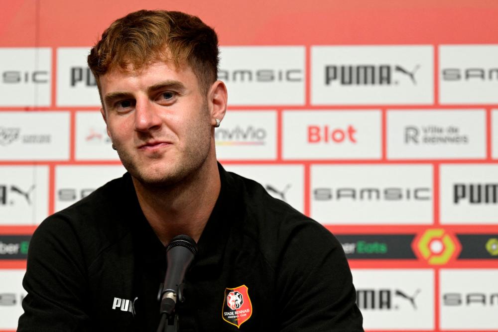 (FILES) In this file photo taken on August 3, 2022 Stade Rennais's newly recruited defender Wales' Joe Rodon gives a press conference during his presentation at the Roazhon Park stadium in Rennes, north-western France. - AFPPIX