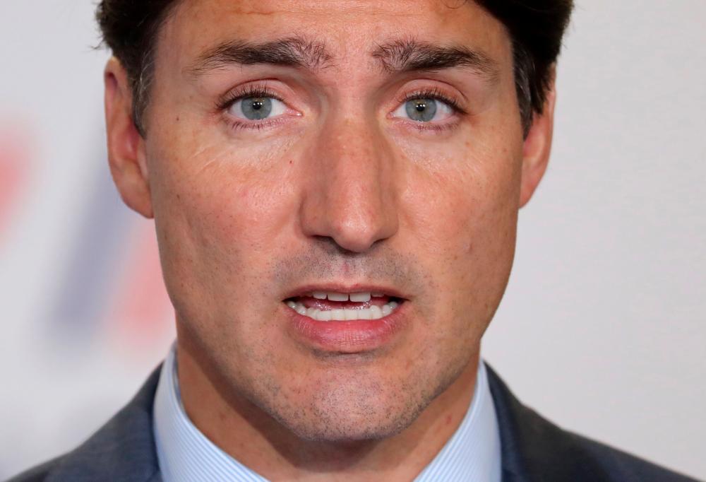 In this file photo taken on August 26, 2019 Canada’s Prime Minister Justin Trudeau addresses media representatives at a press conference in Biarritz, south-west France, on the third day of the annual G7 Summit. — AFP