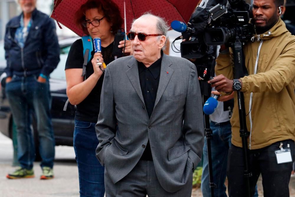 (FILES) In this file photo taken on July 26, 2017 French actor Claude Brasseur leaves after the funeral ceremony for late French actor Claude Rich, at the Saint-Pierre - Saint-Paul church in Orgeval, north-central France. French actor Claude Brasseur has passed at the age of 84, his agent announced on December 22, 2020. / AFP / FRANCOIS GUILLOT
