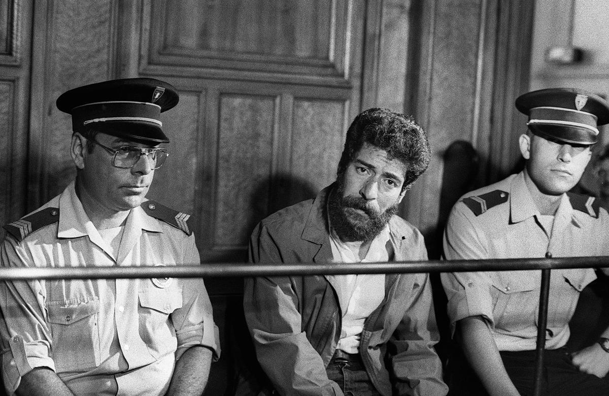 (FILES) A Picture taken July 3, 1986 shows former Lebanese militiaman George Ibrahim Abdallah during his trial for being an accomplice in the murder of two diplomats including Charles Ray of the US and Israeli Yacov Barsimantov, for which Abdallah was condemned to life prison. - Michel VAURIS-GRAVOS and Jean-Marc COLLIGNON / AFP