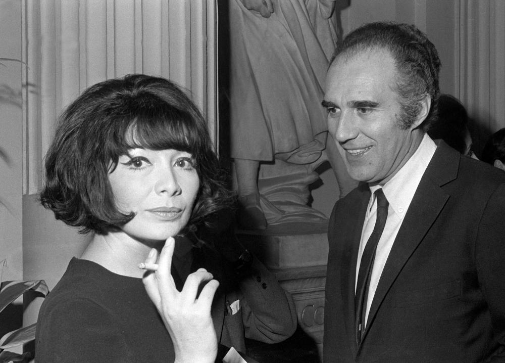 (FILES) In this file photo taken on March 3, 1967, Michel Piccoli and Juliette Greco look on in Paris. Legendary French singer Juliette Greco whose career spanned over half a century, has died aged 93, her family told AFP. “Juliette Greco died on September 23, 2020, surrounded by her family in the house she loved so much. Her life was one like no other,“ her family said in a statement sent to AFP. / AFP / STAFF