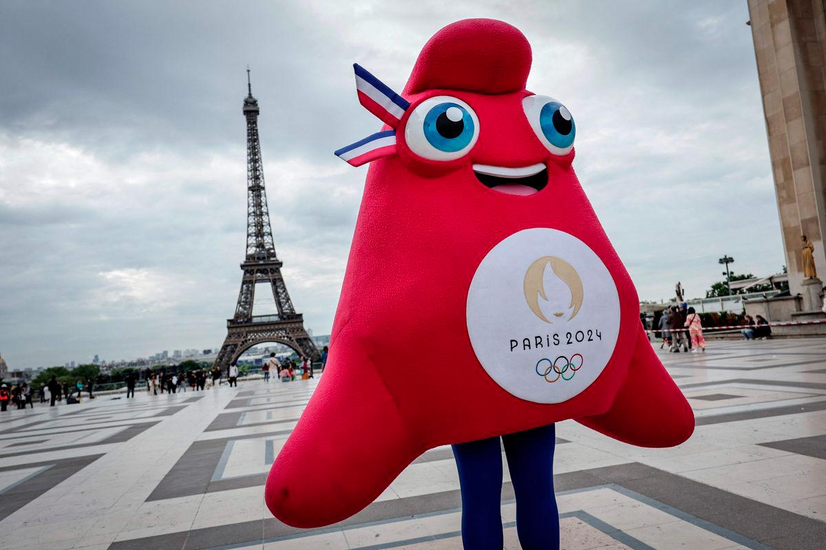 The Phryge, Paris 2024 Olympics mascot poses during a presentation to the press of the Paris 2024 podium on the Trocadero Parvis des Droits de l'Homme (Human Rights square) in front of the Eiffel Tower on May 23, 2024 in Paris. - AFPPIX
