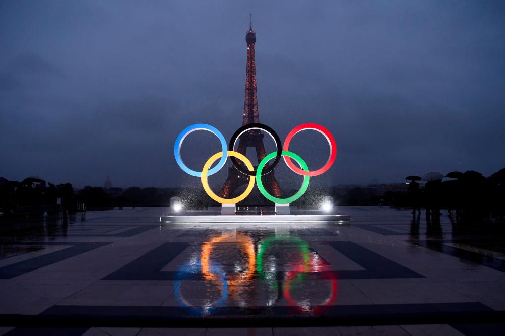 This file photo taken on Sept 13, 2017 shows the Olympics Rings on the Trocadero Esplanade near the Eiffel Tower in Paris, after the International Olympic Committee named Paris host city of the 2024 Summer Olympic Games. Energy giants Total has ruled out sponsoring the 2024 Olympics in Paris, keen to avoid being pilloried in a city where mayor Anne Hidalgo has increasingly campaigned for environmentally sound initiatives. Total's chief executive officer confirmed on June 5, 2019 his company's decision to opt out following a meeting with Hidalgo last week. — AFP