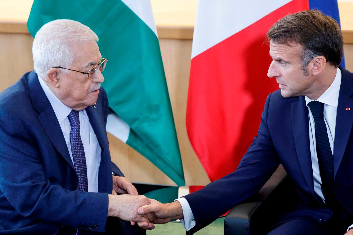 French President Emmanuel Macron (R) shakes hands with Palestinian President Mahmud Abbas during a meeting on the sidelines of the 79th Session of the United Nations General Assembly in New York on September 25, 2024. - AFPPix