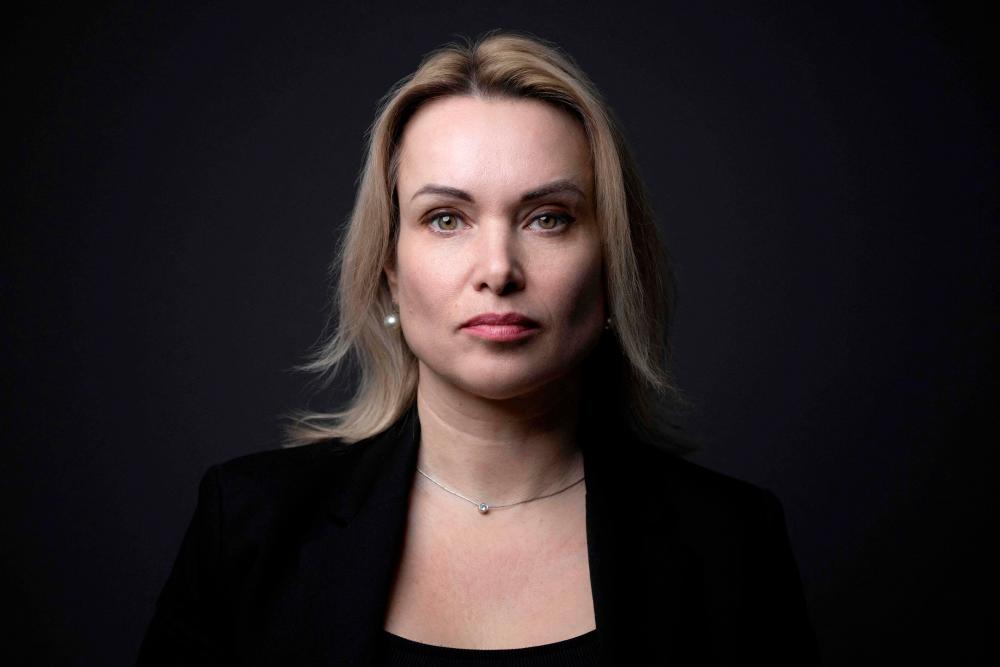 Russian journalist who protested against the invasion of Ukraine live on television Marina Ovsyannikova poses during a photo session before a press conference at “Reporters without borders” (RSF) NGO in Paris on February 10, 2023/AFPPix
