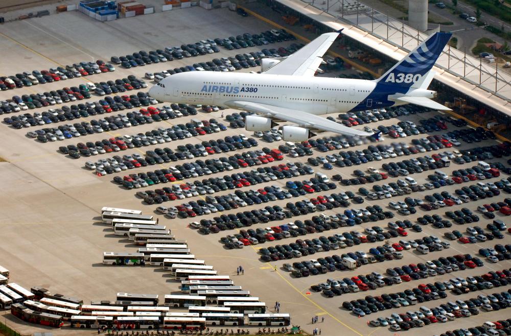 In this file photo taken on Aug 27, 2005 the giant Airbus A380 aircraft flies over the Airbus plant in the northern town of Hamburg-Finkenwerder, during its first flight in Germany. — AFP