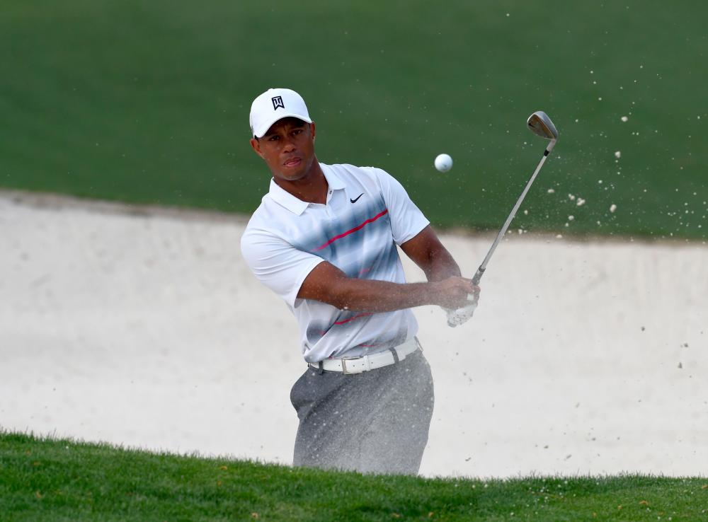 In this file photo taken on April 9, 2015, Tiger Woods hits out of the sand on the 10th hole during Round 1 of the 79th Masters Golf Tournament at Augusta National Golf Club in Augusta, Georgia. — AFP