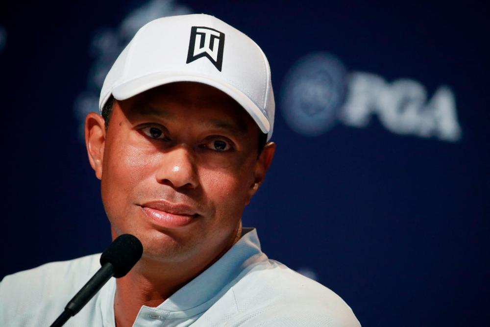 (FILES) In this file photo Tiger Woods of the United States speaks to the media during a press conference prior to the 2018 PGA Championship at Bellerive Country Club on August 7, 2018 in St. Louis, Missouri. - AFP