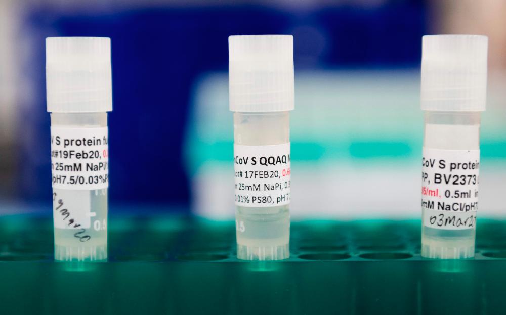 In this file photo three potential coronavirus, Covid-19, vaccines are kept in a tray at Novavax labs in Gaithersburg, Maryland on Mar 20, 2020, one of the labs developing a vaccine for the coronavirus, Covid-19. — AFP