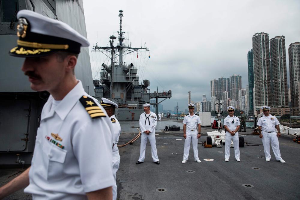 This file photo taken on April 20, 2019 shows crew members standing on the deck of the USS Blue Ridge during a port call in Hong Kong. - AFP