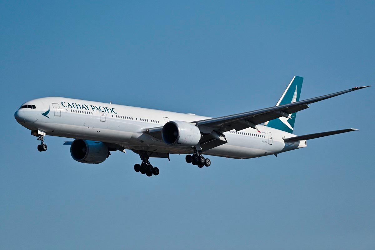 (FILES) A Cathay Pacific Boeing 777-300ER aircraft. - ADEK BERRY / AFP