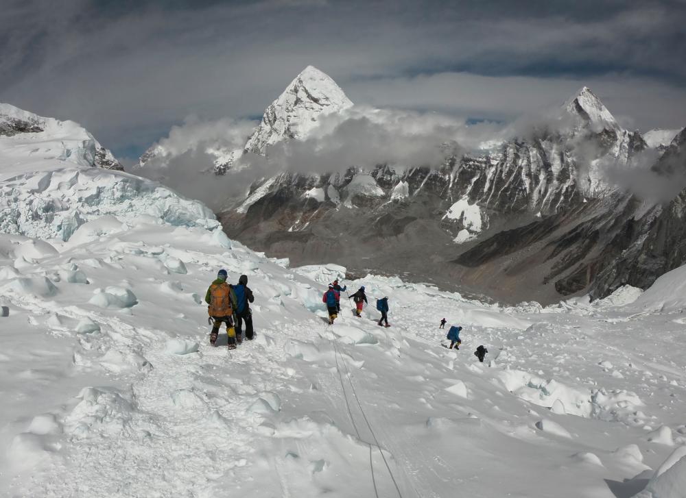 In this file photo taken on April 29, 2018, mountaineers walk near camp one of Mount Everest, as they prepare to ascend on the south face from Nepal. - AFP