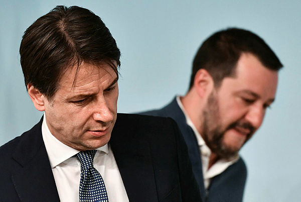 In this file photograph taken on January 14, 2019, shows Italy’s Prime Minister Giuseppe Conte (L) and Italy’s Interior Minister and deputy PM Matteo Salvini attending a press conference at Palazzo Chigi in Rome. — AFP