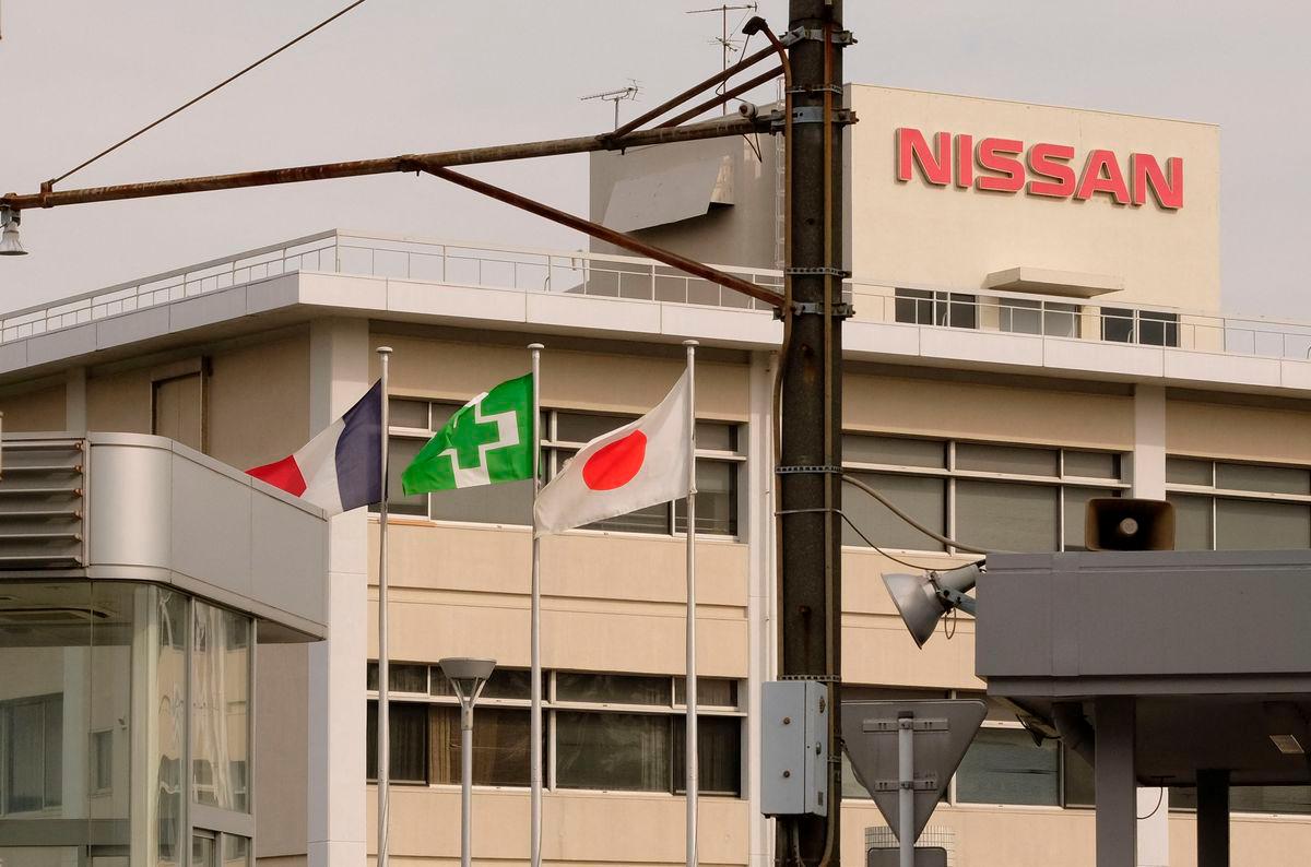 The national flags of France (L) and Japan (R) are displayed at an entrance of Japan’s Nissan Motor’s Oppama plant in Yokosuka, Kanagawa prefecture, on November 26, 2018. AFPPix