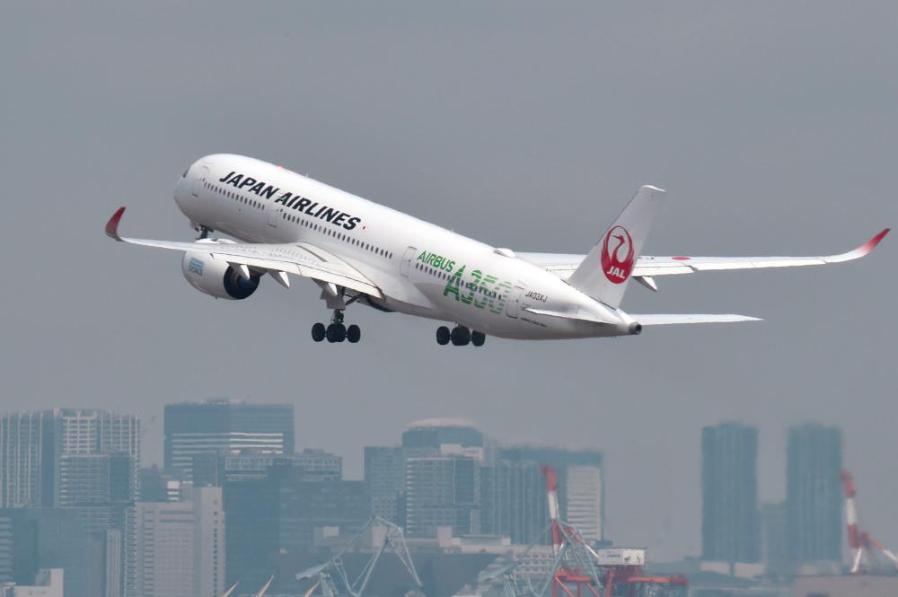 In this file photo taken on Apr 28, 2020 a passenger jet from Japanese carrier Japan Airlines (JAL) takes off from Tokyo’s Haneda airport. Japan Airlines is ditching the phrase “ladies and gentlemen” in announcements made in aircrafts and by staff at airports from Oct 2020, embracing gender-neutral terms instead, a spokesman said on Sept 28, 2020. — AFP