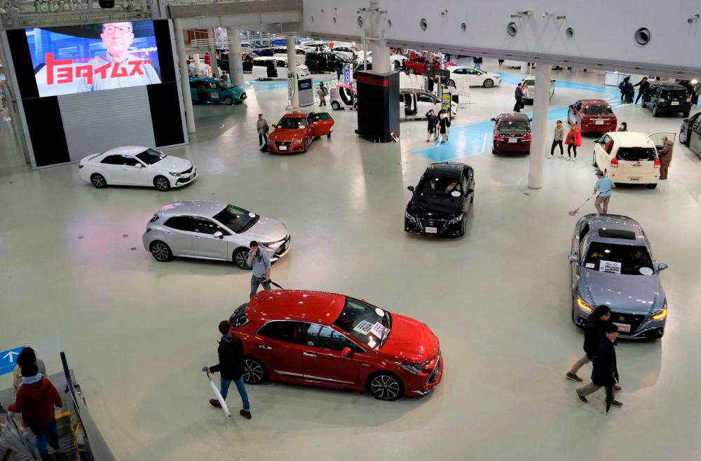 A Toyota Motor car showroom in Tokyo. At the spring session of labour talks, set to wrap in mid-March, major firms, such as Toyota, negotiate with in-house unions to set wages for the coming fiscal year from April. – AFPpic