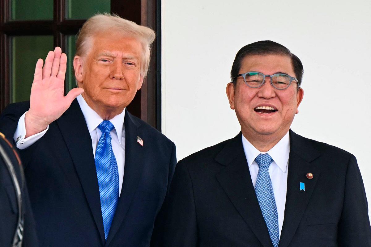 (FILES) US President Donald Trump waves as he greets Japanese Prime Minister Shigeru Ishiba upon arrival outside the West Wing of the White House in Washington, DC, on February 7, 2025. - Mandel NGAN / AFP