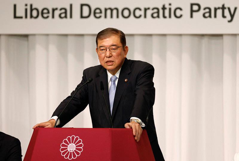 (FILES) This file photo taken on September 13, 2024 shows Japan's former defence minister Shigeru Ishiba speaking during a joint news conference at the LDP headquarters in Tokyo. Former defence minister Shigeru Ishiba will become Japan's next prime minister after winning the ruling party's leadership vote on September 27, 2024 the official count showed. - Franck ROBICHON / POOL / AFP