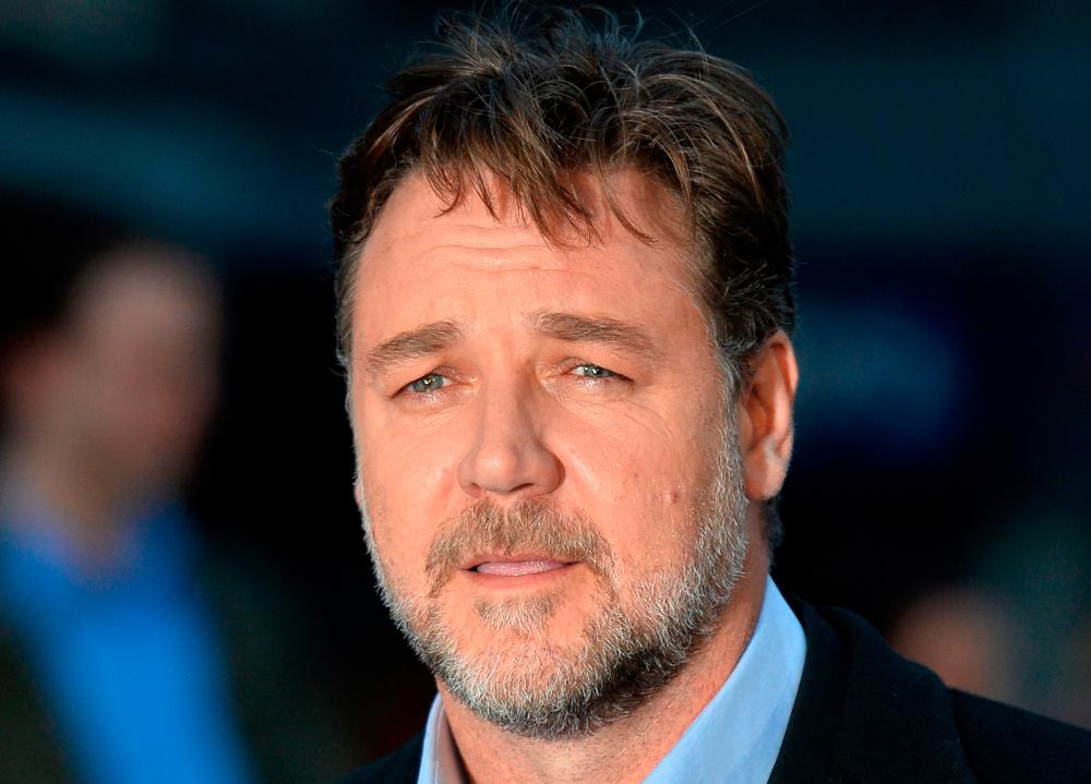 In this file photo taken on March 31, 2014, New Zealand-born Australian actor Russel Crowe poses for pictures on the red carpet as he arrive for the UK premiere of his latest film Noah in Leicester Square, central London. / AFP / Ben STANSALL