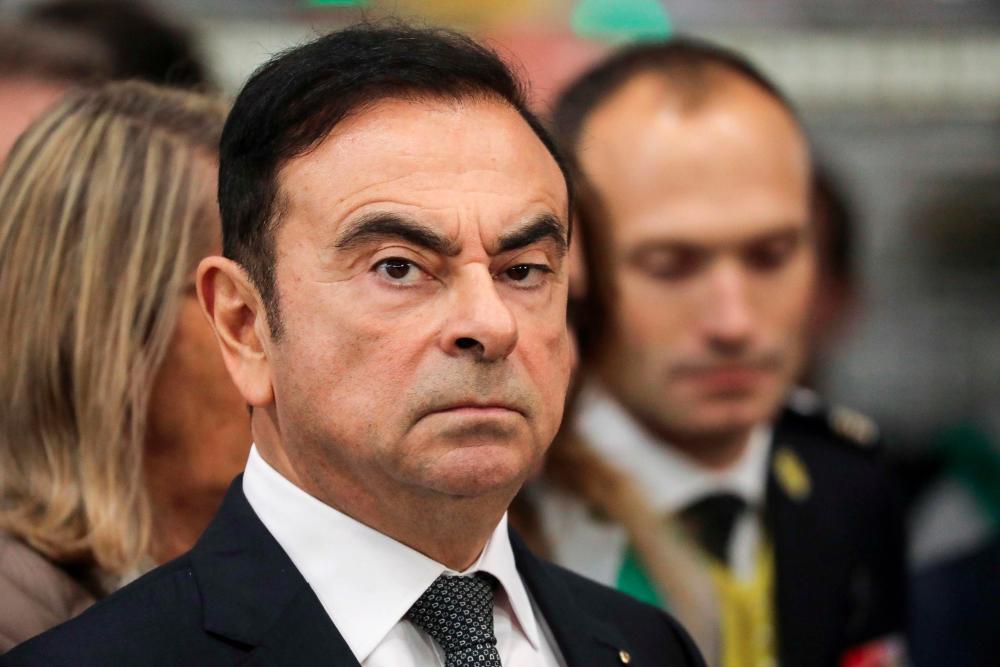 In this file photo taken on Nov 8, 2018 then Chairman and CEO of Renault-Nissan-Mitsubishi Carlos Ghosn looks on during a visit of French President at the Renault factory, in Maubeuge, northern France. — AFP