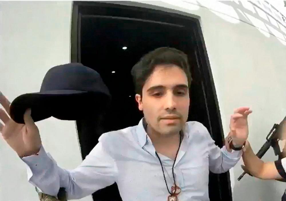 Screenshot dated on October 17, 2019 of a handout video released on October 30, 2019 by the Mexican Government’s Production Centre for Informative and Special Programmes (CEPROPIE) shows the moment of the arrest of alleged trafficker Ovidio Guzman, son of jailed drug kingpin Joaquin “Chapo” Guzman. AFPPIX