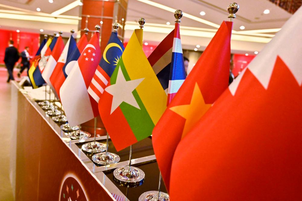 (FILES) In this file photo taken on November 4, 2019, the Myanmar national flag (C) is seen with flags of member countries attending the 35th Association of Southeast Asian Nations (Asean) Summit in Bangkok. - Romeo GACAD / AFPPix