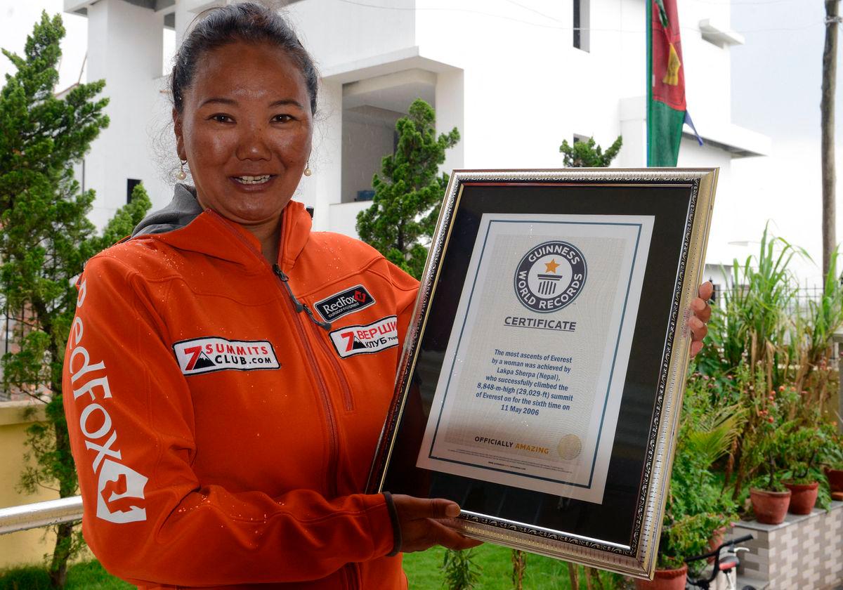 Nepalese climber Lhakpa Sherpa, who holds the world record for most successful climbs of Mount Everest for a woman with seven ascents, poses with her Guinness record certificate in Kathmandu on May 27, 2016. AFPpix