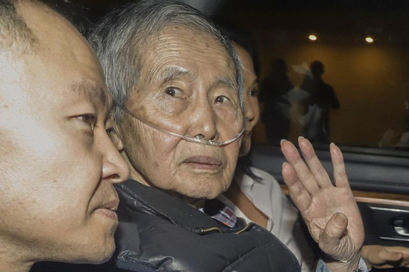 (FILES) Former Peru’s President (1990-2000) Alberto Fujimori sits between his children Kenji (L) and Keiko upon his release from the Barbadillo prison in the eastern outskirts of Lima, on December 6, 2023. Former Peruvian President Alberto Fujimori, 85, will be a presidential candidate in the next elections in 2026, his daughter Keiko Fujimori, leader of Peru’s main right-wing party, announced on July 14, 2024. - AFPpix