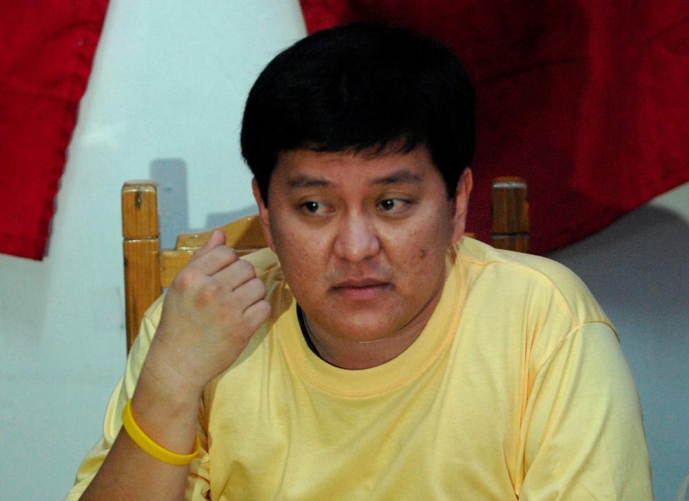 In this file photo taken on April 20, 2010, detained Maguindanao massacre suspect Andal Ampatuan Jnr gestures during a press conference at Camp Bagong Diwa in the Manila suburb of Taguig. — AFP