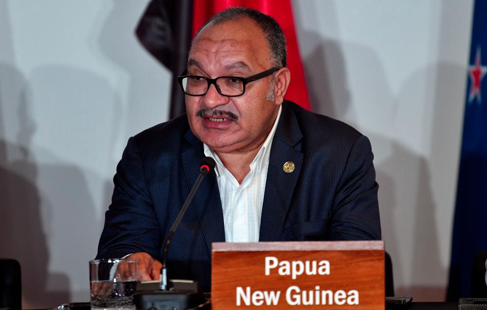 In this file photo taken on Nov 18, 2018 Papua New Guinea's Prime Minister Peter O'Neill speaks at an electricity projects signing ceremony during the Asia-Pacific Economic Cooperation (APEC) Summit in Port Moresby. O'Neill resigned on May 26, 2019. — AFP