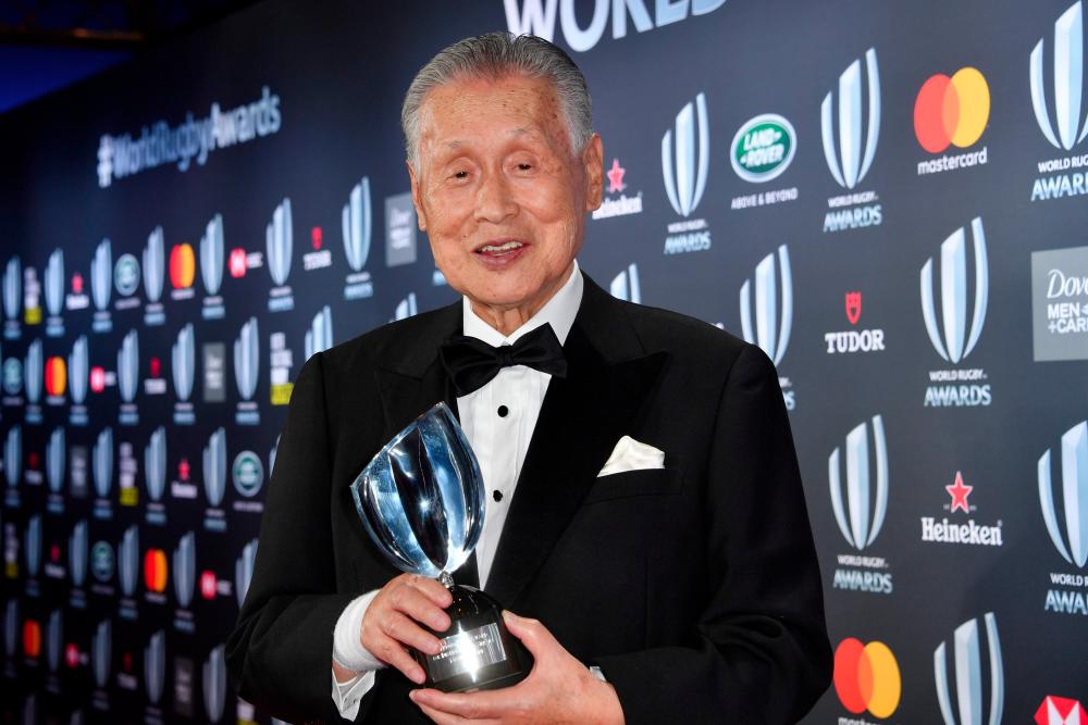 This file photo taken on Nov 25, 2018 shows the Vernon Pugh Award for Distinguished Service winner, former Japanese prime minister Yoshiro Mori, posing with his trophy during the World Rugby Awards ceremony in Monaco. — AFP