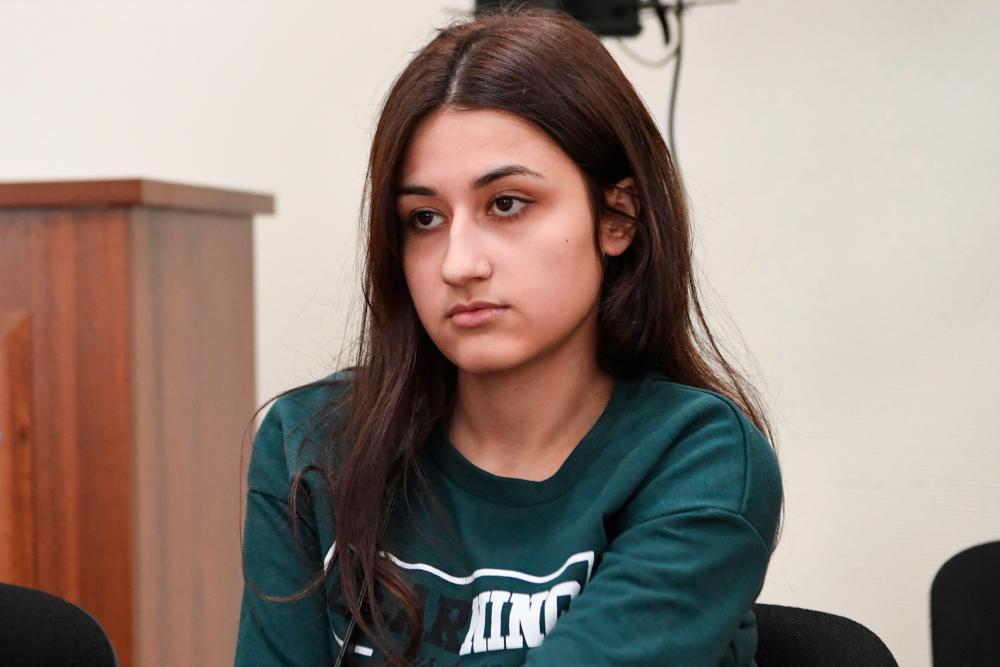 In this file photo taken on June 26, Krestina Khachaturyan, one of three teenage sisters accused of murdering their father, attends a hearing at a court in Moscow. — AFP
