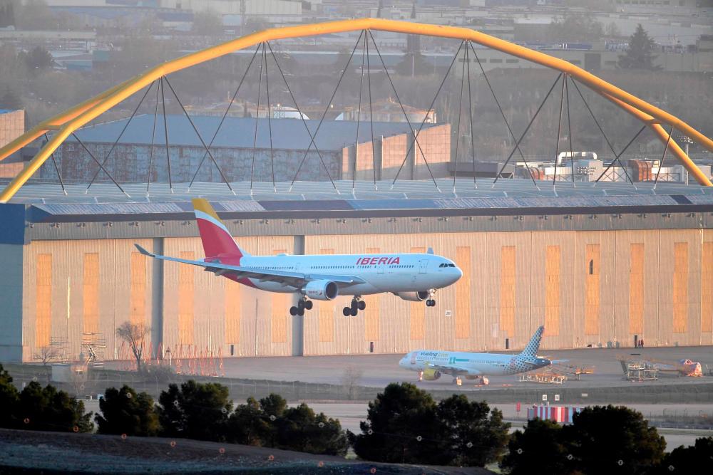 A plane by Spain’s flagship carrier Iberia lands at Madrid-Barajas Adolfo Suarez Airport on February 3, 2020 in Madrid. Spanish airports have welcomed 283 million passengers in 2023, announced the Aena managing company on January 15, 2024, a record attendance that exceeds pre-pandemic levels/AFPPix