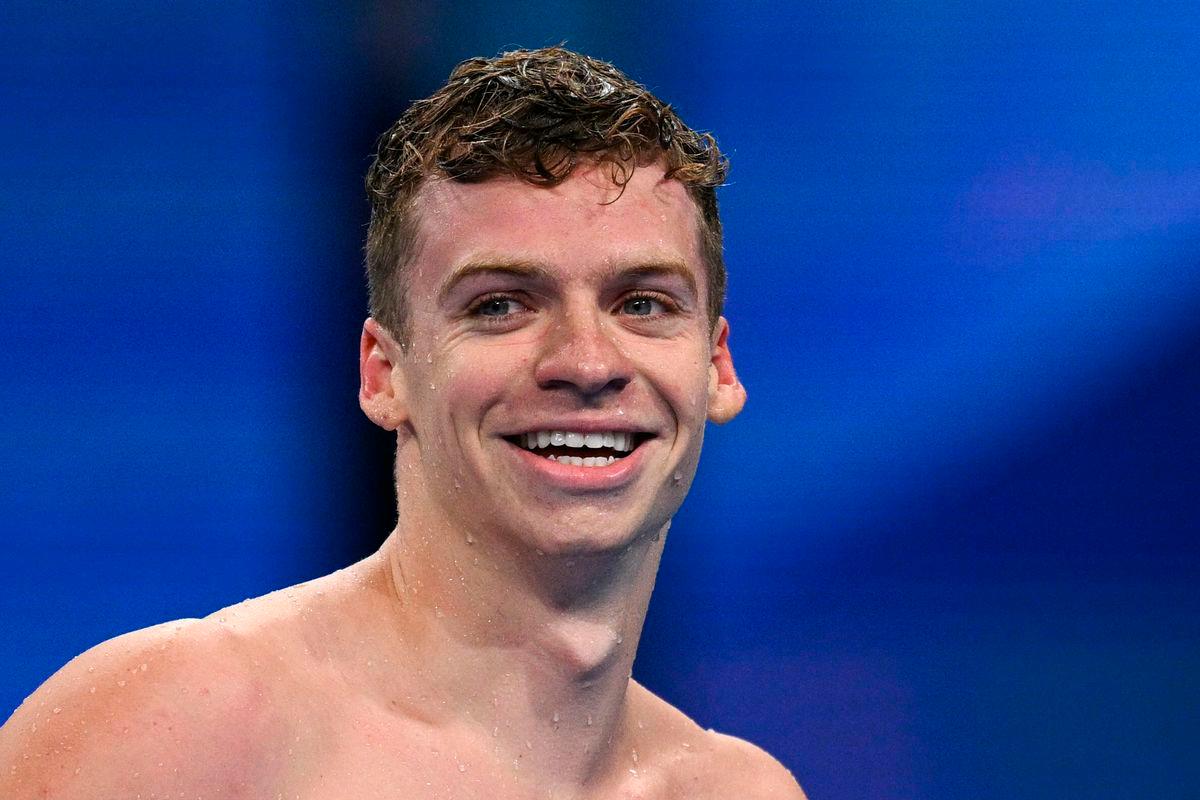 (FILES) Gold medallist France’s Leon Marchand reacts after competing in the final of the men’s 200m individual medley swimming event during the Paris 2024 Olympic Games at the Paris La Defense Arena in Nanterre, west of Paris, on August 2, 2024. Photo by Oli SCARFF / AFP