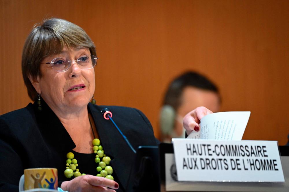(FILES) In this file photo taken on February 28, 2022 United Nations High Commissioner for Human Rights Michelle Bachelet delivers a speech at the opening of a session of the UN Human Rights Council in Geneva. AFPPIX